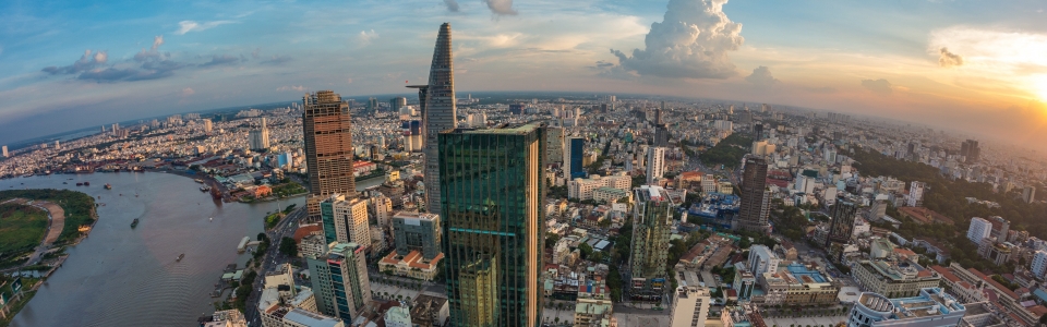 HO CHI MINH, VIETNAM – NOV 20, 2017: Royalty high quality stock image aerial view of Ho Chi Minh city, Vietnam. Beauty skyscrapers along river light smooth down urban development in Ho Chi Minh City